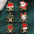 Close-up of 6pcs Christmas open rings featuring Santa, reindeer, and tree on green background - Christmas Theme 6-Piece Ring Set (8165)