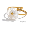 Detailed view of a 12mm white shell flower ring on an 18K gold plated band - Ring