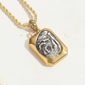 Detailed macro view of a dual-tone geometric pendant necklace with mythical engraving - Square Relief Pendant
