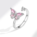 Macro view of adjustable silver butterfly spinner ring with pink zircon crystals - AJ101 Silver Pink Zirconia