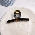 Macro view of amber tortoiseshell hair claw clip with twisted resin texture on a plate - Glossy Light Tortoise - Butterfly Buckle Straight (Approx 11.3cm)