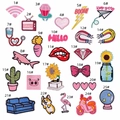 Flat lay of 25 colorful cartoon embroidery patches featuring various cute designs - Mix 25pcs Set
