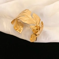 Detailed macro view of gold leaf pattern cuff bracelet on white silk fabric - 1# Bracelet-Gold (Leaf Style)