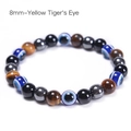 8mm Yellow Tiger Eye bracelet with Evil Eye beads and black obsidian on white background - 8mm - Yellow Tiger Eye