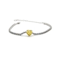 Macro shot of silver bracelet with heart-shaped yellow gemstone and white zircon setting - Yellow