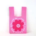 Detailed view of the thick knit texture and pink floral pattern on a bucket bag - Rose Red Large Flower