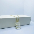 Frosted crystal bear necklace with gold star detail on a minimalist white box - Necklace / Clear