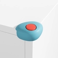 Blue and red L-shape silicone corner protector installed on white furniture edge - Shell Dual Color-Blue