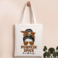 Detail of canvas tote bag featuring Pumpkin Spice vibes illustration on a wooden hook - PUMPKIN SPICE Vibes Print