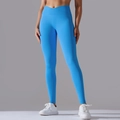 Detail of high-waisted seamless yoga pants featuring a cross V-waist and ribbed texture - S / Royal Blue