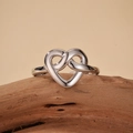 Minimalist S925 sterling silver ring with silver heart knot design on wood - Adjustable Open / White Gold