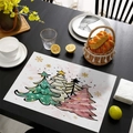 Christmas placemat featuring three cartoon trees and golden snowflakes on a white background - CD57-12