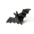 Close-up detail of gothic black bat ring with realistic wings for Halloween style - Adjustable Open / Black