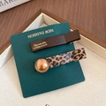 Vintage hair clip set featuring dark brown barrette and leopard print with gold accent - Vintage Dark Brown Leopard Hair Clip Set