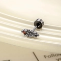 Black metal wing cartilage stud earring featuring a vibrant red gemstone inlay - Black Red Stone Right (Single)