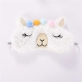 Close-up of plush alpaca sleep mask with colorful pom-poms and closed eyes embroidery - Cream Alpaca