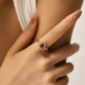 Detailed view of an irregular gold ring featuring a purple gemstone and micro-pave diamonds - Adjustable Open / Purple (KR0043-1)