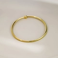 Minimalist golden bangle with polished metal bead decoration in an open-end design - Bead Style (S285)