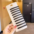 Set of 10 matte black minimalist snap hair clips on a decorative white display card - 10pcs Black Bobby Pin Set
