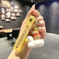 Capybara keychain with yellow silicone strap and cute capybara riding a small white duck - B241-7 White Duck