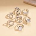 Detailed view of silver rings set with irregular pearls and liquid metal design - Silver (7-Piece Set)