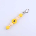 Detail of sunflower silicone bead keychain with yellow petals and silver metal lobster clasp - Nude