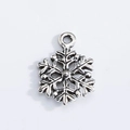 Macro detail of snowflake pendant in antique silver finish for DIY jewelry crafting - Retro Snowflake