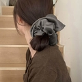 Oversized dark gray satin scrunchie shown in use for a voluminous ponytail hairstyle - Dark Gray