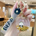 Panda floating liquid keychain with golden glitter and gray silicone wrist strap - Alarm Clock