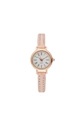 Detail view of round rose gold quartz watch with pink leather strap and Roman numerals - Pink