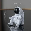 Sitting white astronaut figure, 5.2cm height, minimalist space themed desk ornament - No.11 Black Astronaut / 4.5x5.2x4.1cm