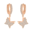 Detailed view of rose gold butterfly drop earrings with shimmering zircon pavé setting - Rose Gold Butterfly