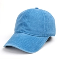 Macro shot of embroidered eyelets and reinforced stitching on washed denim baseball cap - Cyan Blue