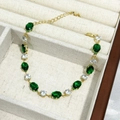 Elegante bracciale dorato con smeraldo ovale e zircone da donna, catena regolabile - Oro