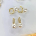 U-shaped gold pearl earrings with micro-set cubic zirconia in a geometric design - Gold