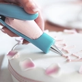 Handheld manual cake spray gun for pink frosting application on white mousse cakes - Multifunctional Set / 1 Handle + 2 Converters + 2 Bags + 2 Nozzles / Blue