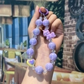 Purple acrylic beaded phone strap with unicorn and heart charms in a handheld display - Purple Unicorn