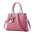 Pink PU leather handbag with contrasting black trim, bow accent and golden hardware - Dusty Pink