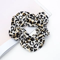 Elastic velvet scrunchie featuring a classic black and white leopard pattern on a white desk - Style 8 Black White Gold Leopard