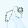 Silver ring set with oval green moss agate and opal stones on a light blue background - US 6 / Silver