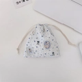 Blue and white striped drawstring bag with vintage cartoon bear and floral patterns - Badge Bear