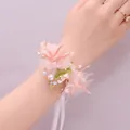 Detail of pink floral wrist corsage with pearls and ribbons for flower girls - Wrist Flower / Fruit Green Wrist Flower