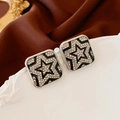 Detailed close-up of square star earrings with black enamel and sparkling rhinestones - Silver Star Square (Silver Needle)