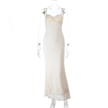 Detail of white lace slip dress featuring a slim mermaid cut and thin shoulder straps - XS / Apricot
