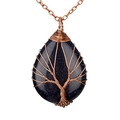 Detailed view of large teardrop Blue Sandstone pendant with Tree of Life wire wrapping - Blue Sandstone Antique Bronze