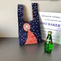 Navy knit tote bag with white polka dots and orange abstract embroidery detail - Polka Dot Navy