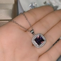 Elegant silver necklace featuring a large square purple gemstone pendant held by hand - Tz-40 [purple Diamond]