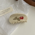 Detail of a beige cream hair claw clip with red rose and brown checkerboard patterns - Beige Red Rose Pattern Claw