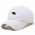 White cotton baseball cap featuring black polar bear embroidery and curved brim - White