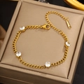 Close-up of gold chain bracelet with four-claw set zircons on premium leather gift box - Gold Four Zircon Ring Chain (LM715)
